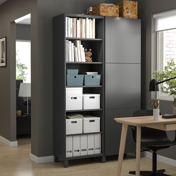 Modern office with BESTÅ storage, organised books, desk, and chair.