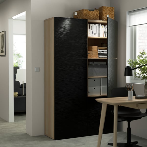 Office cabinet with adjustable shelves and sliding doors.