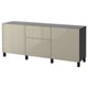 Modern BESTÅ sideboard sleek beige cabinets with black legs, offering ample storage with adjustable shelves behind push-to-open doors.