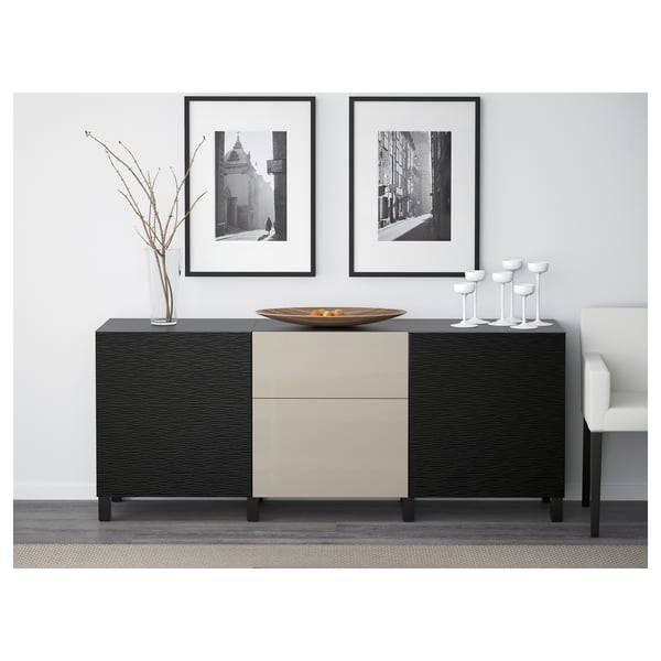 Modern furniture setup with BESTÅ sideboard, featuring drawers and cabinet, styled with decor items, framed art, and chairs.
