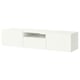 An IKEA BESTÅ tv bench in white. It a sleek, rectangular design with a large central open section for cable management and two enclosed storage areas.