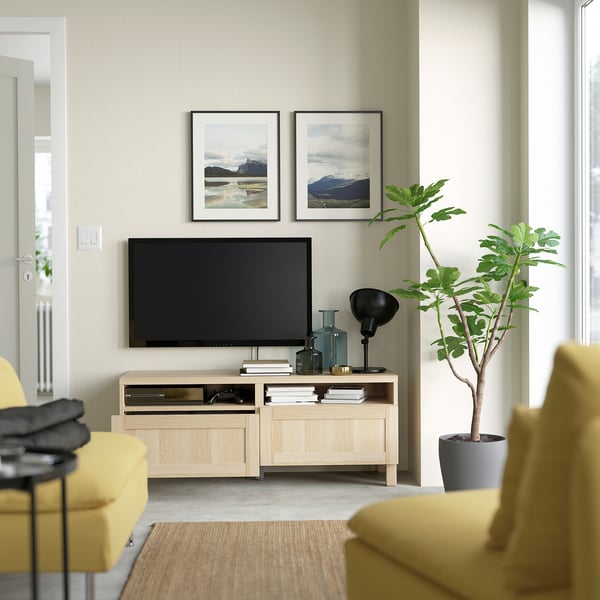 Modern living room with BESTÅ tv bench, featuring cable management, soft-closing drawers, and wall mounting for safety.