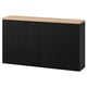 Black BESTÅ sideboard with oak top, two doors, minimalist design.