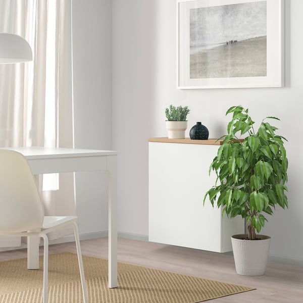 Minimalist home office: BESTÅ, desk, chair, plant, decor.