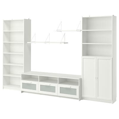 White BILLY storage combo: bookshelves, cabinets, tv bench. Maximizes storage.