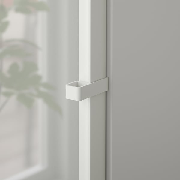 Modern white cabinet with sleek handle; high-quality finish, minimalist design.