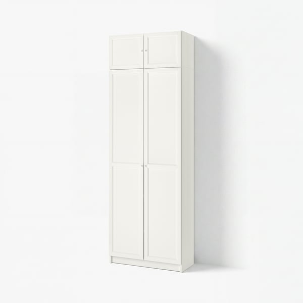 A white BILLY bookshelf with two doors, featuring an adjustable shelf and clean, modern design.