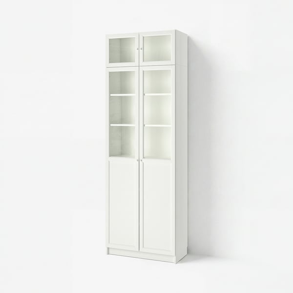 White BILLY bookcase with glass doors, offering storage and display space. Tall, rectangular, with a modern design.