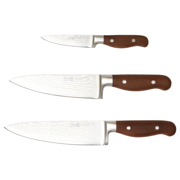 Three ikea BRILJERA knives with wooden handles, stainless steel blades, and various sizes displayed vertically.
