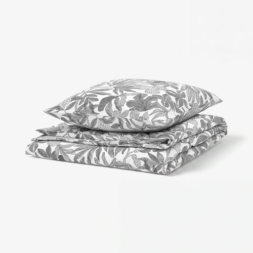 Black and white bed linens with floral pattern.