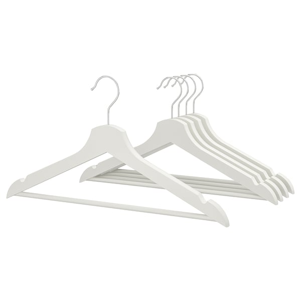 Six light-colored wooden hangers with chrome hooks arranged neatly, designed to keep clothes organised.
