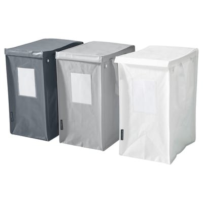 Three DIMPA waste sorting bags in black, light grey, and white. They are rectangular, durable, with side handles and clear label pockets.