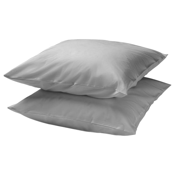 Two square, light grey DVALA pillows stacked, soft cotton material, clean and simple design.