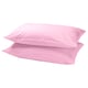 Two pink DVALA silk-like pillows stacked neatly, smooth texture, simple design.