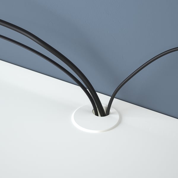 Black EKET suspension rail mounted on white wall, showcasing cable management feature.