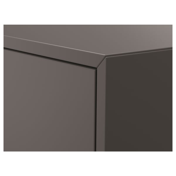 A corner of a dark grey EKET cabinet, highlighting its sleek, modern design and precise craftsmanship.