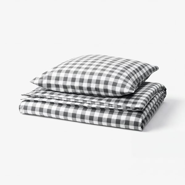 Folded grey and white chequered duvet cover set with zippers, made of 100% organic cotton.