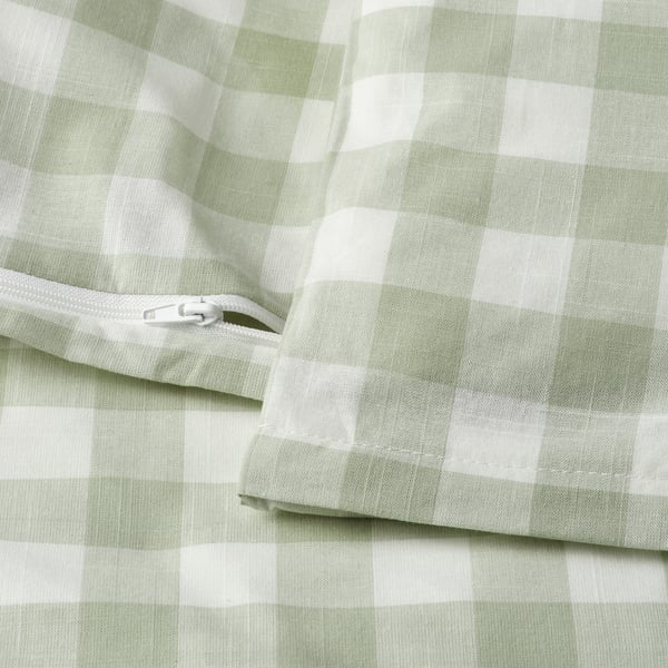 A light green and white chequered duvet cover with a visible zip closure. Part of an organic cotton bedding set.