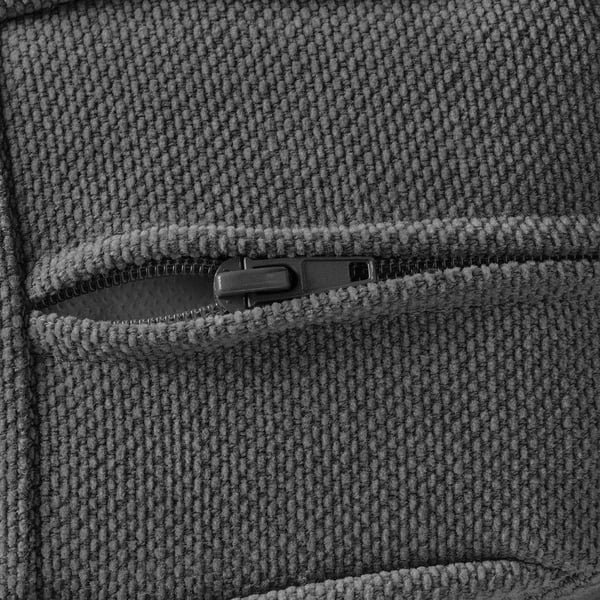 Close-up view of textured fabric with zip, showcasing high-quality material and detail.