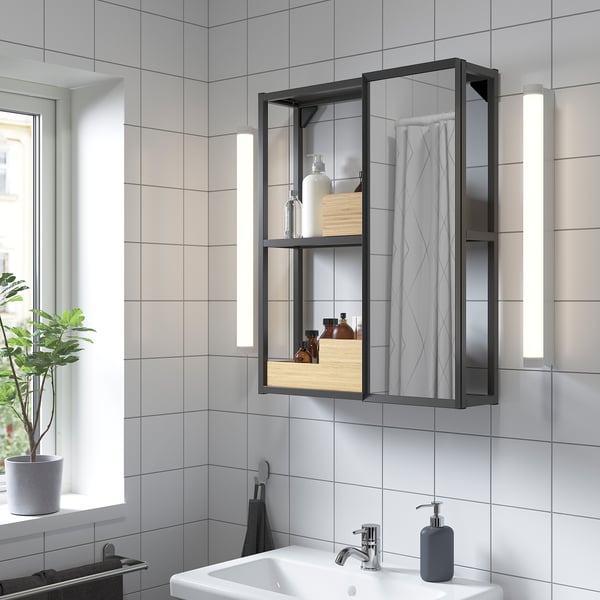 Modern bathroom: ENHET glass cabinet, sink, towels, plant.
