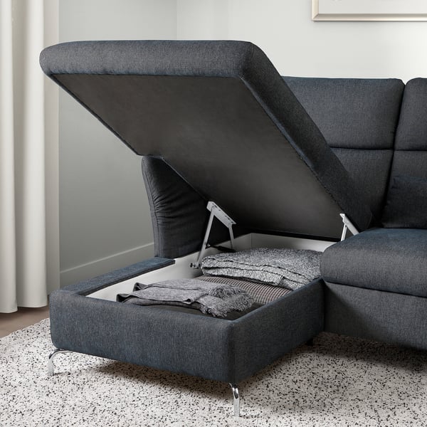 Sofa with lift-up seat revealing storage, knives inside.