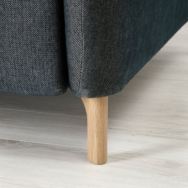 Modern sofa with adjustable sections, wood legs, dark grey fabric.