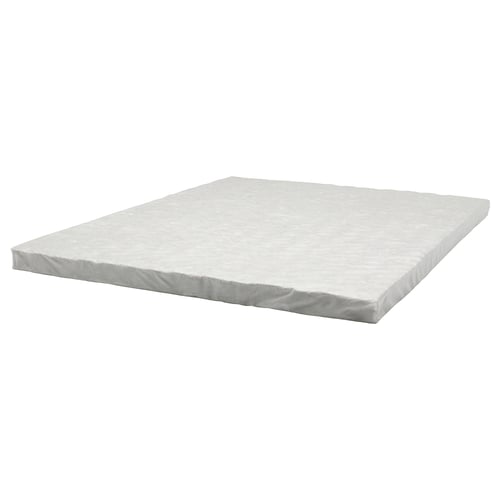 A FÖLUNGEN spring core mattress topper. Its white, square-shaped, and designed to enhance comfort by providing extra support.