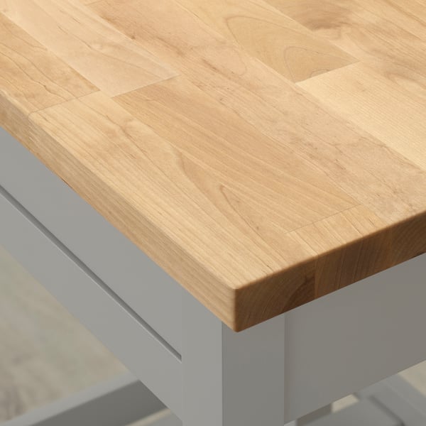 Light wood kitchen island with clean design; smooth, natural finish; sturdy legs imply good quality and durability.