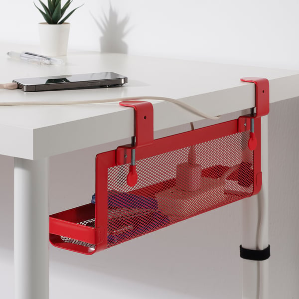Red mesh cable tray hangs under desk, keeping wires organised and workspace tidy.
