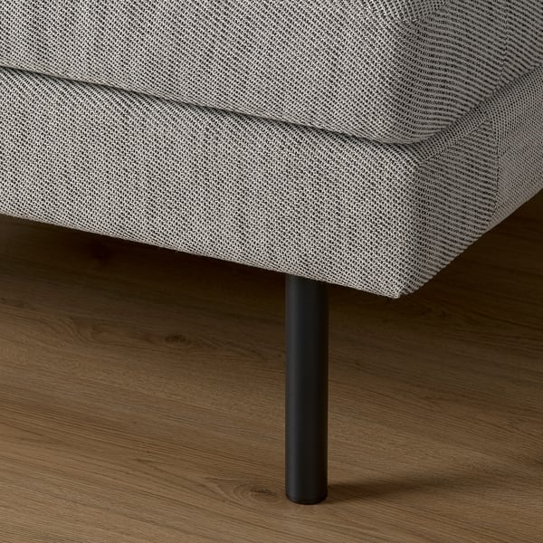 Close-up of sofa leg, sleek black finish, supporting cushioned seat, modern style.