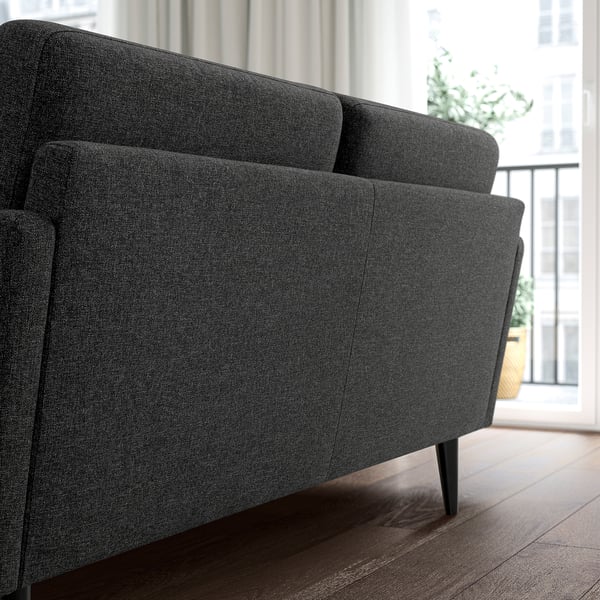 Modern GRILLSTORP grey sofa, sleek design, dark wood floor, city view. Comfortable, compact sofa perfect for small spaces.