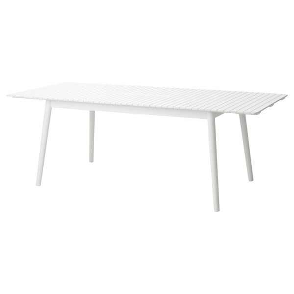 A white, rectangular HATTHOLMEN extendable dining table with sleek metal legs, designed for 4-6 people.