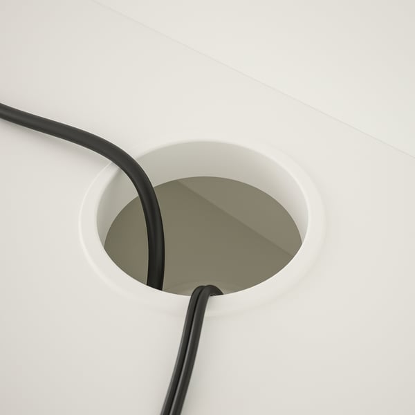 Desk with built-in cable management, keeping cords tidy and accessible.