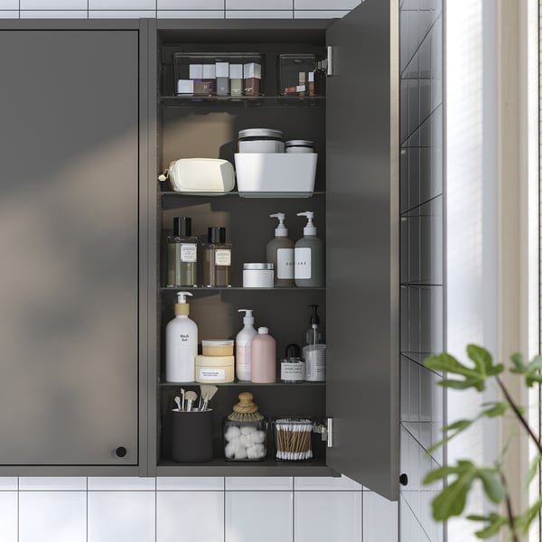 Llevel grey wall cabinet, open, dark grey, with multiple shelves, products organised, modern minimalist style.
