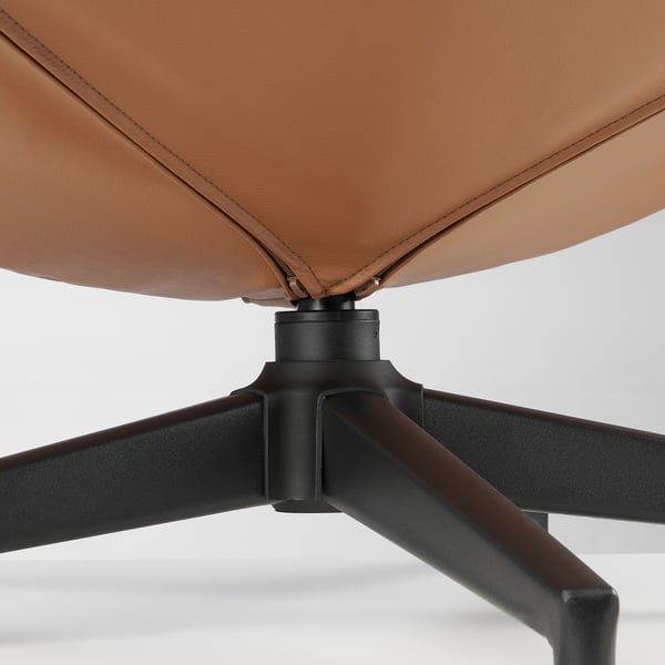 Brown leather footstool with sturdy black metal base,’detailing high quality stitching.