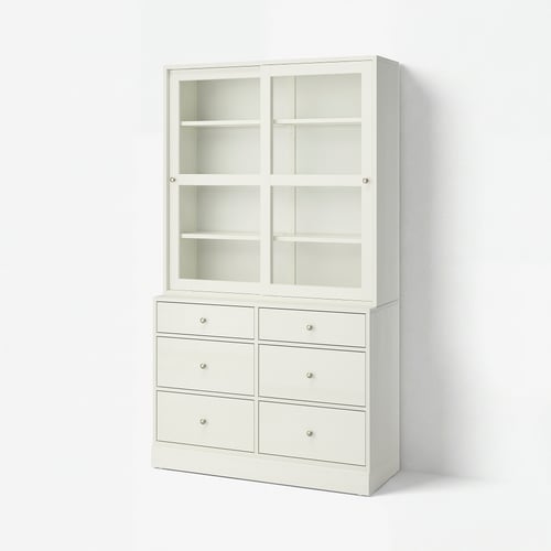 White HAVSTA furniture set: cabinet with glass doors, six drawers, pine wood, clean lines.