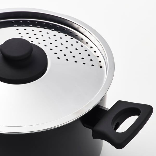Non-stick cookware, steam holes, black handle, stainless steel lid.