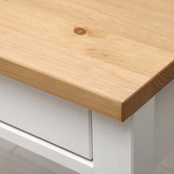 Wooden desk, clean lines, sturdy finish.