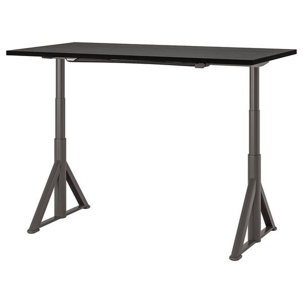 IDÅSEN adjustable black standing desk, modern design with triangular legs.