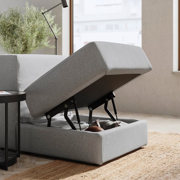 JÄTTEBO grey sofa with storage. Modern, light grey, modular design. Open seat reveals hidden compartment.