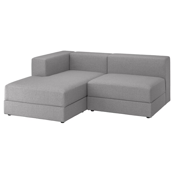 Modern grey modular sofa with chaise, clean lines, soft cushions, under-seat storage.