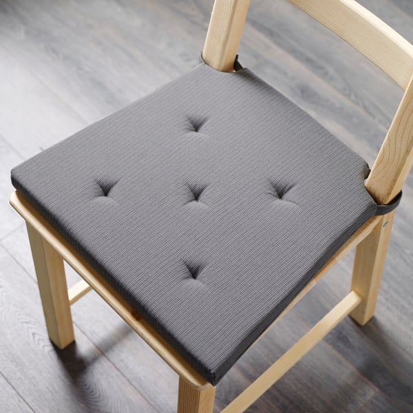JUSTINA chair pad in blue, square & cushioned, fits standard wood chairs, adds comfort.