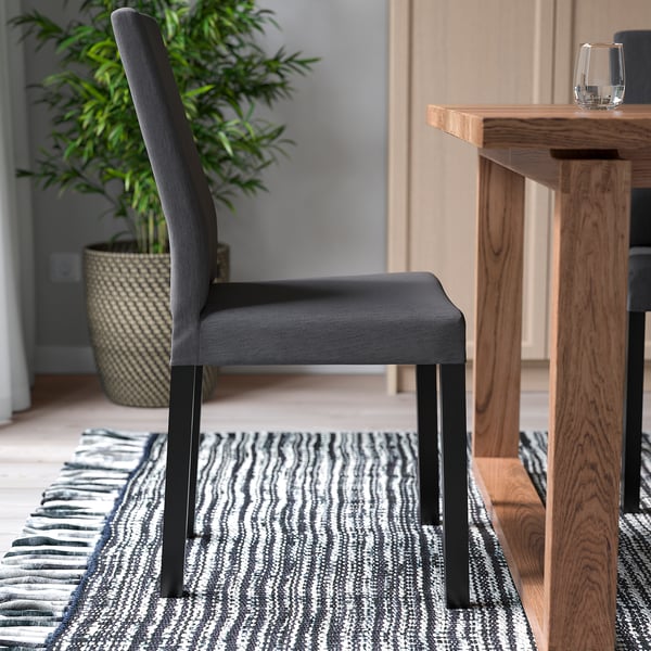 Chair with high back for comfort, padded seat and back, durable fabric, easy to clean cover.