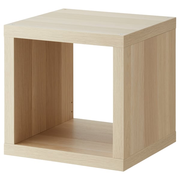 A KALLAX cube shelving unit in light oak finish made from recycled material, featuring a minimalist and versatile design.
