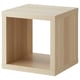A KALLAX cube shelving unit in light oak finish made from recycled material, featuring a minimalist and versatile design.