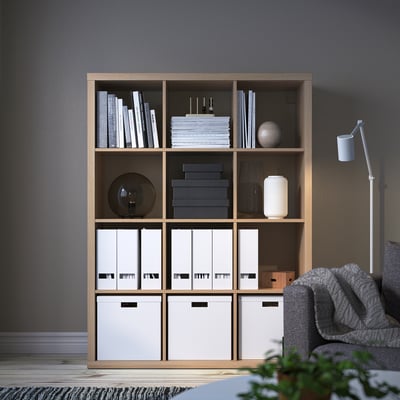KALLAX shelving unit with books, decor, and storage.