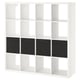 A white KALLAX shelving unit with four dark inserts, square shape, clean design.