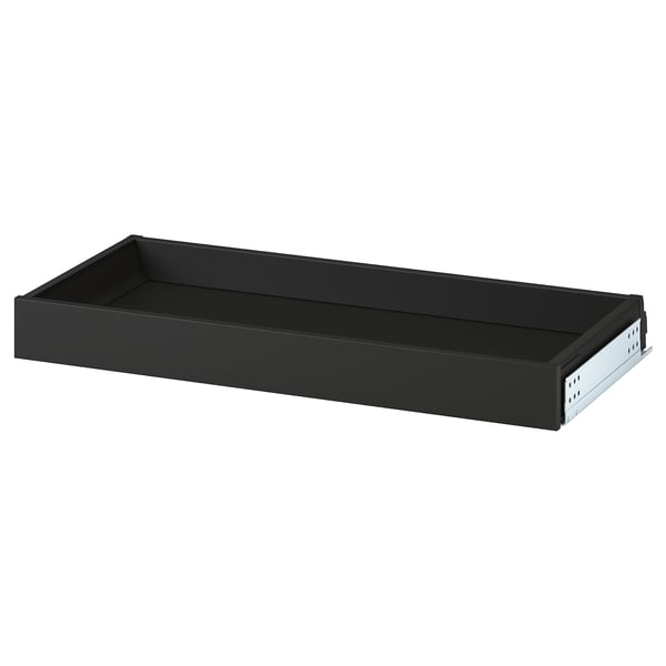 Black steel drawer, handle-free, smooth action.