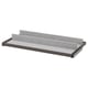 A grey KOMPLEMENT pull-out tray with felt lining for organising items in a wardrobe.