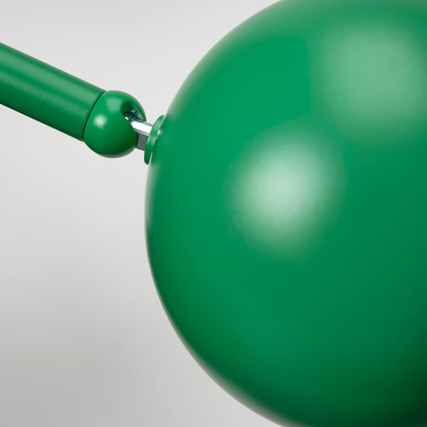 A green adjustable lamp, high-quality steel and plastic, smooth finish.